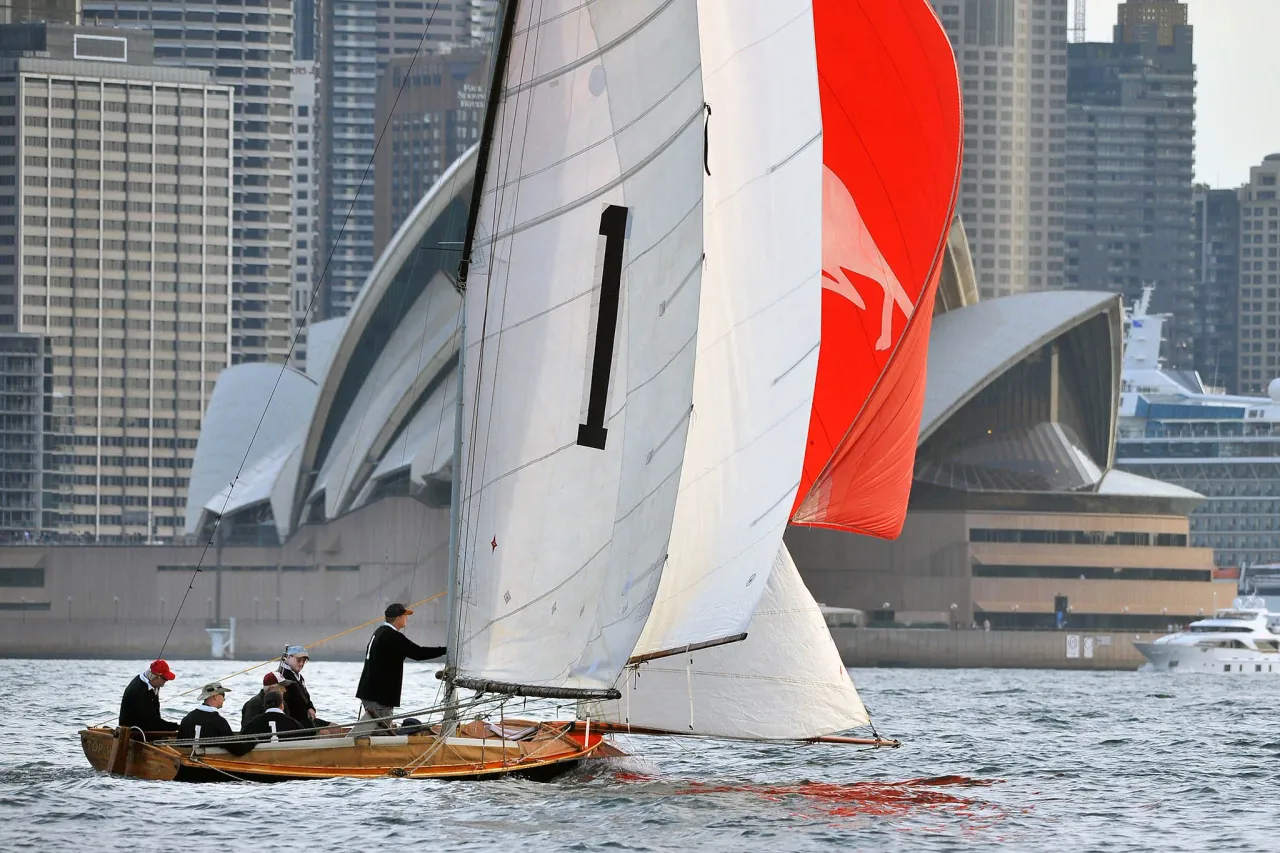 Yendys flying her red kangaroo spinnaker close under the Sydney Opera House